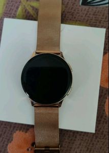 Gold Smartwatch And Two Dresses