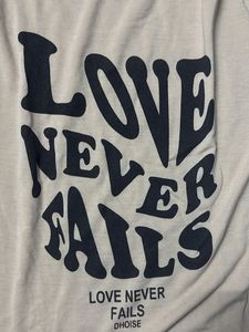 Love Never Fails Graphic Tee