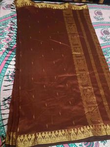 Elegant Brown And Golden Saree