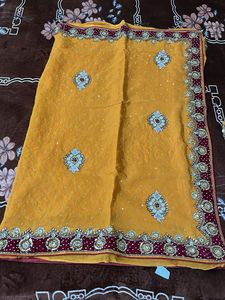 heavy work yellow red velvet border saree with blo