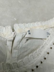 White Embroidered Peplum Top