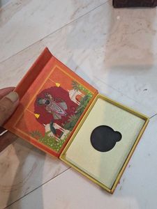 orange silver coin empty box