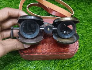 Binocular With A Leather Bag.