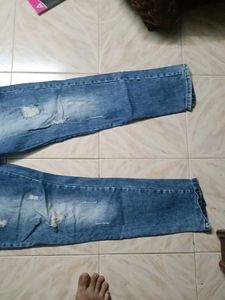 Distressed Blue Denim Jeans
