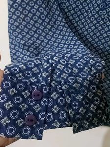 Blue Printed Georgette Top With Fold Up Sleeves.