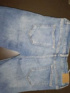 Ripped Knee Jeans