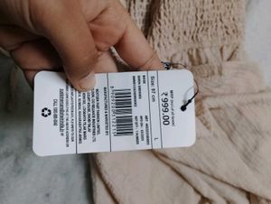 Beige Romper with Ruffle Detail