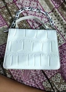 white hand purse