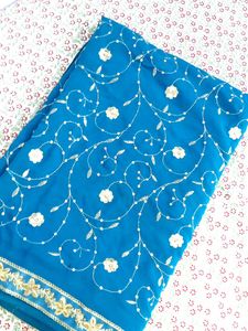 ✨ Teal Blue Saree with Golden Floral Elegance ✨