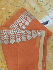 Orange saree with silver embroidery