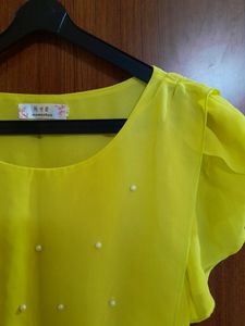 yellow cinched waist top