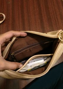 cream colour sling bag