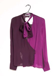 Branded two- tone wrap top.