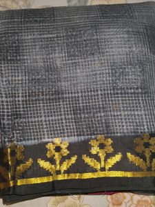 i am selling black golden saree