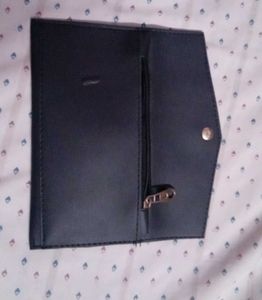 black clutch and guess watch