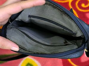 Good condition crossbody blue leather bag.