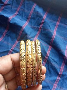 Elegant Gold Tone Bangles - Set of Two