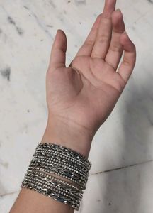 Combo Of One Black Metal Necklace With Earings And A Set Of Silver Bangles