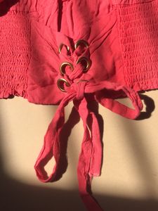 pink stretchy top with flowers embodery