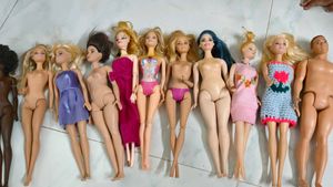 Lot of 11 Barbie Dolls