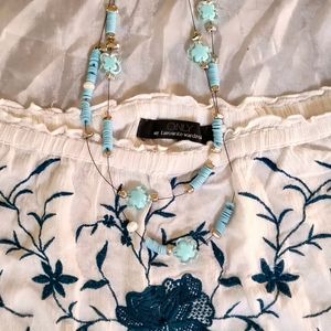 white viscose top with blue embroidery 𐙚
