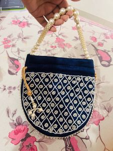 Elegant Heavy Blue Pearl Potli Bag with Tassels