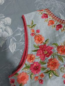 A beautiful grey lehenga with pink detailing