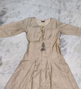cream gown with mint green jacket