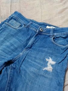 Distressed Denim Jeans With Scratches