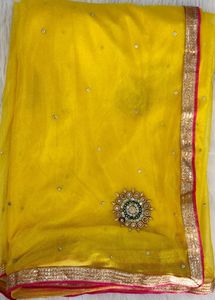 Elegant Yellow Saree with Pearl Details