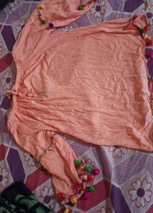 Peach Top with Pom-Pom Detail