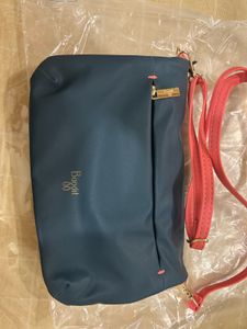 Baggit  Coral  and Teal reversable Crossbody Bag