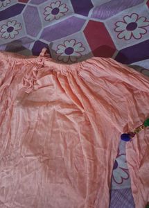 Peach Top with Pom-Pom Detail