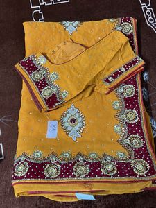 heavy work yellow red velvet border saree with blo