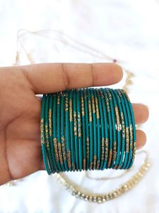 Set Of Bangles And Two Bracelets