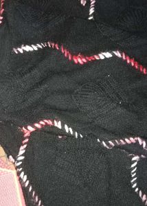 Cozy Black Knit Sweater with Wavy Trim