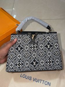 Louis Vuitton Capucine Handbag with sling belt