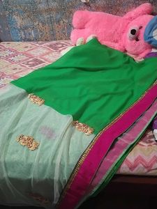 Saree half green and white combination.
