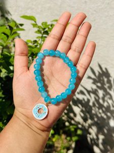 Light Blue Glass Beads Bracelet With Hanging Charm.