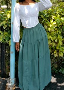 White Corset Top And Green Maxi Skirt