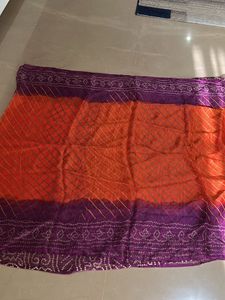 Lovely orange and purple bandhej Saree
