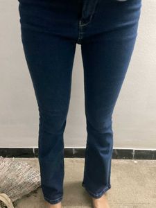 Perfectly new pair of blue bootcut denim jeans.