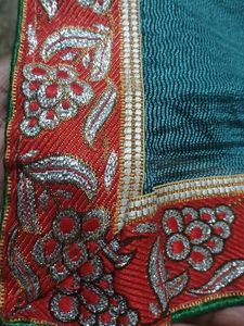 Embroidered super net saree with red border