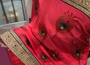 Elegant Pink Sari with Peacock Design