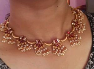 Gold-Toned Necklace with Red Stones and Pearls