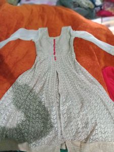 beautiful party wear golden net gown style long kurti with red plazoo and red dupatta
