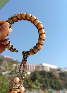 Elegant Pearl Bangle with Tassels
