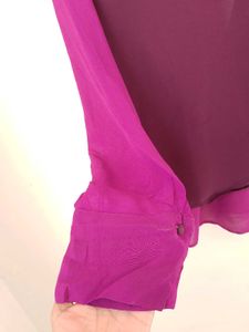 Branded two- tone wrap top.