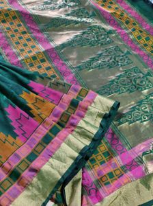Green kanchipuram silk saree.