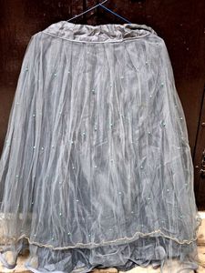 black paplum blouse and grey skirt